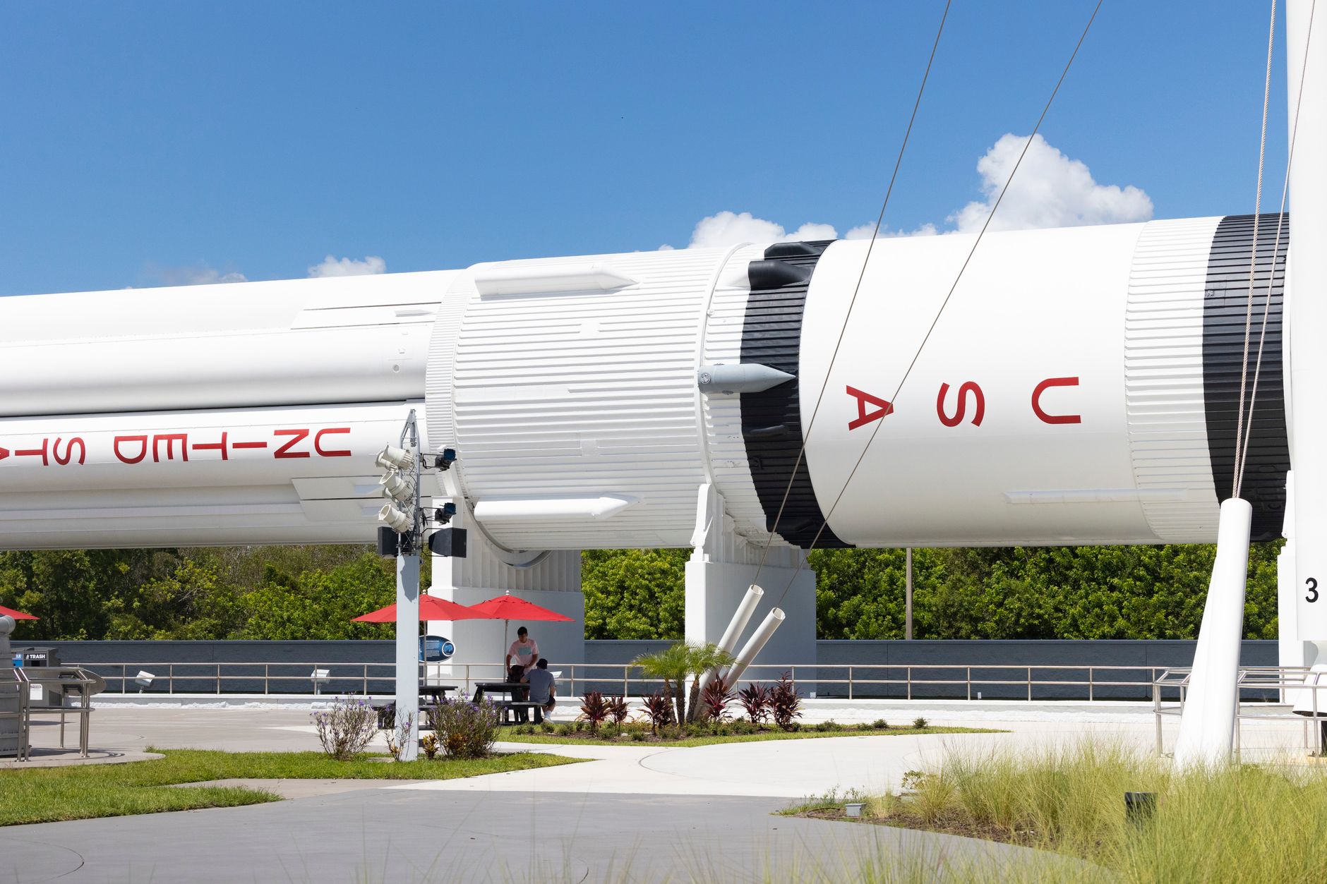 A detailed view of a rocket at Cape Canaveral's Kennedy Space Center with clear skies.